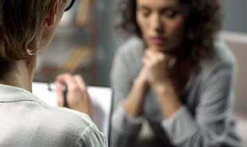 women taking notes