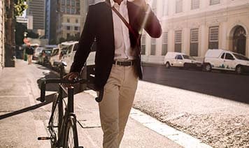 man walking with his bike