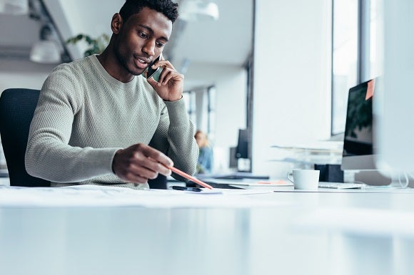 man on phone in office man on phone in office