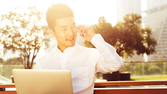 asian man on the phone asian man on the phone discussing interview tips