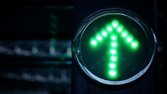 a traffic light with green arrow