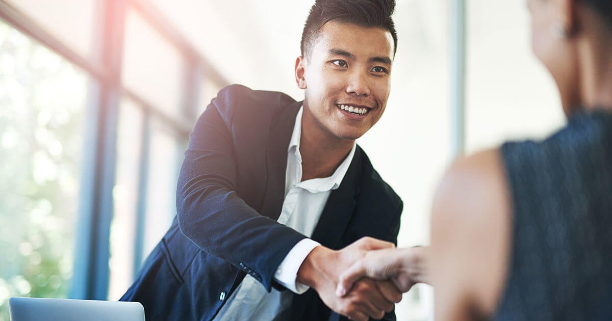 Man greeting interviewer Man greeting interviewer