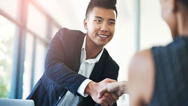 man greeting interviewer man greeting interviewer