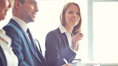 Woman asking a question in a business meeting