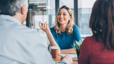 Three business professionals in meeting