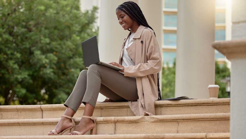 Woman checking laptop