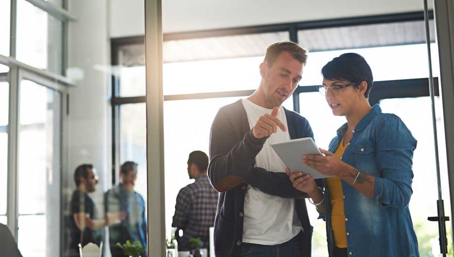 Giving his input. Shot of a two colleagues having a conversation